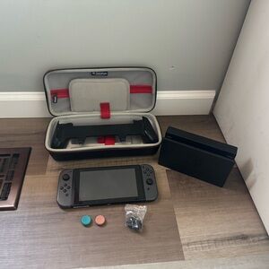 Nintendo Switch with Black and Gray Accessories